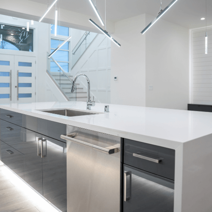 man in black sweatpants using DEWALT circular saw and cutting a wood plank